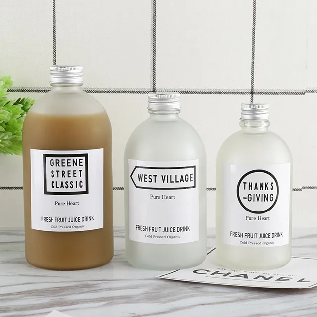 new design wholesale price available different sizes frosted and clear glass juice bottle