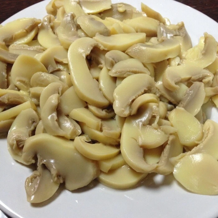 champions mushroom in jar, fresh canned mushroom pieces, canned king oyster mushroom