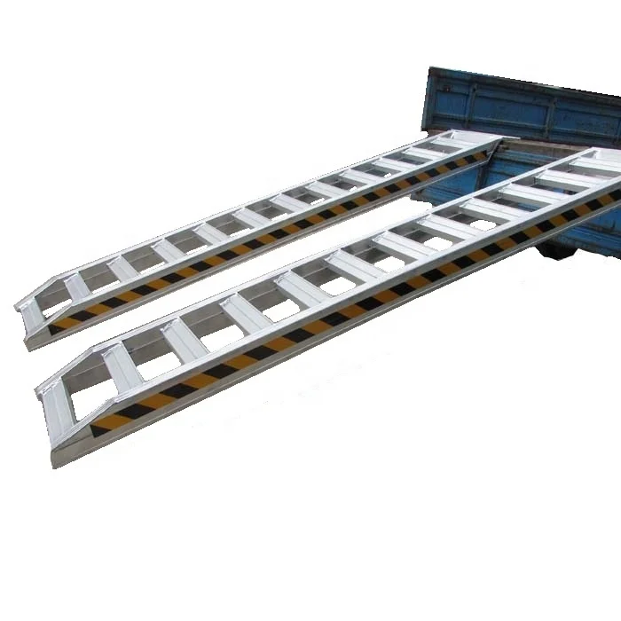 Aluminum loading ramps used for Kubota excavators