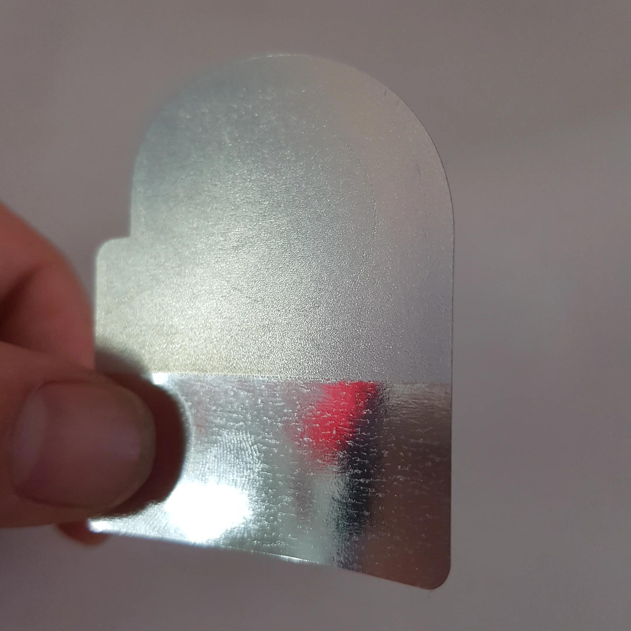 
both sides printed partial adhesive PVC silver label stickers,half glue label stickers , half adhesive label/sticker 