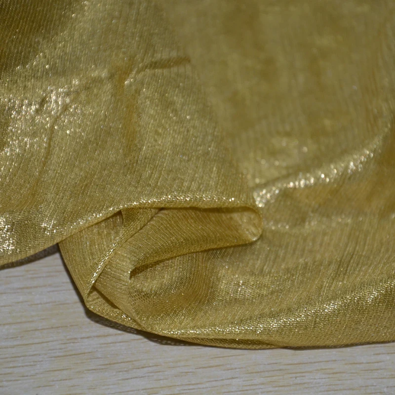 
silk gossamer golden shiny silk tulle fabric with foil 