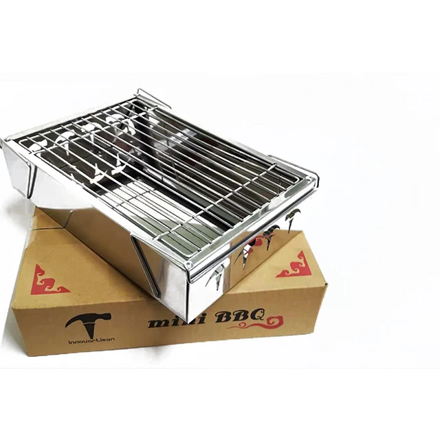 
Camping disposable portable foldable stainless steel mini bbq charcoal grill stove on table 