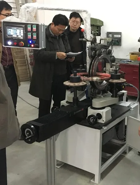 Dual-station toroidal coil winding machine and insulation tapping machine