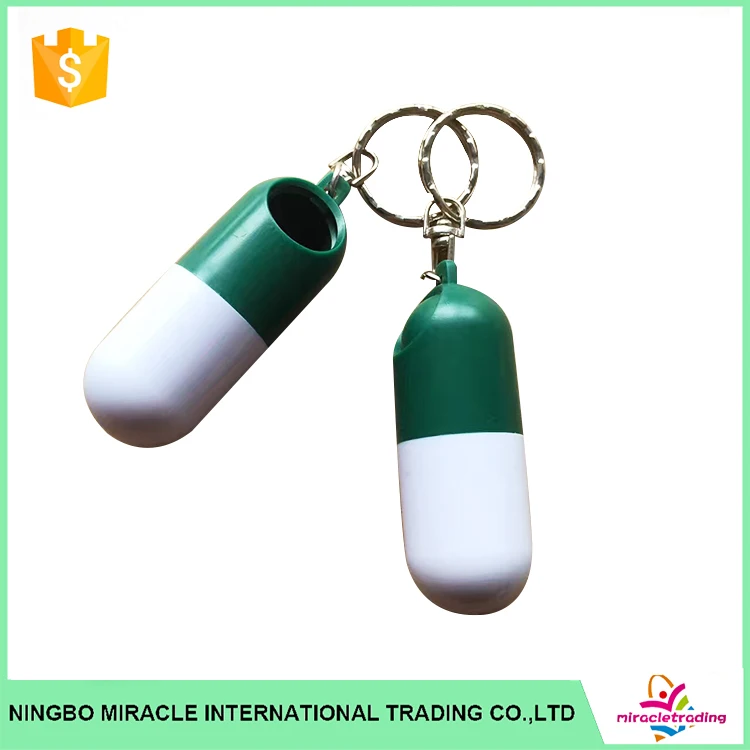 portable capsule shaped pill box with keychain