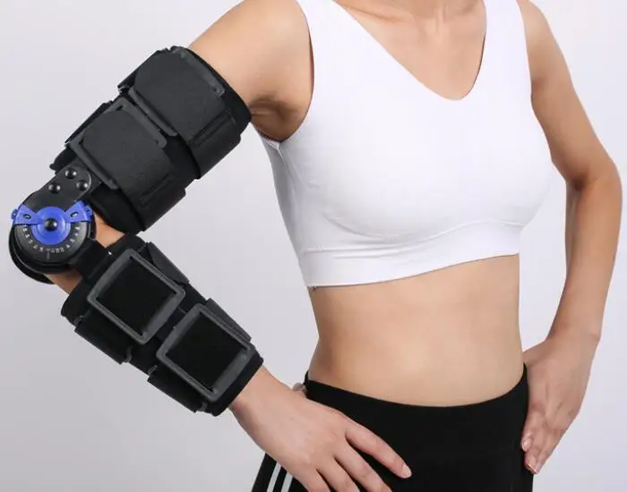 Adjustable elbow fixation support with single-sided hinge design for limiting position