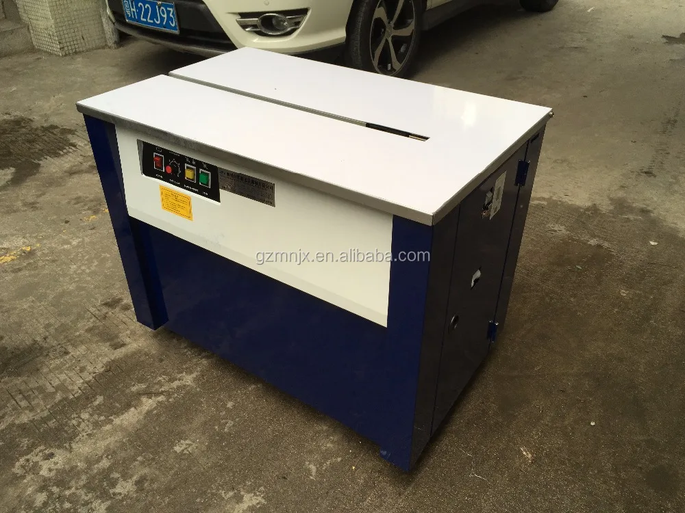 Guangzhou MingNa transpak pp packing slipper banknote carton pp strap pressure type plasticpet strap machine