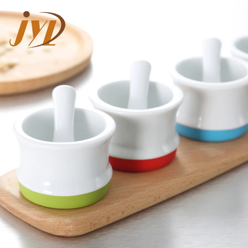 
China factory new design mini size herb spice small ceramic mortar and pestle with Silicone anti-skid ring 