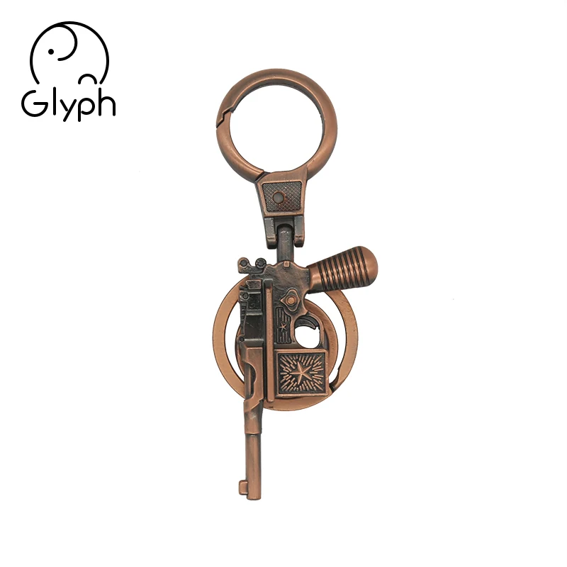 Wholesale 3d bronze fancy gun shaped keychain handmade craft keyring for promotional gift