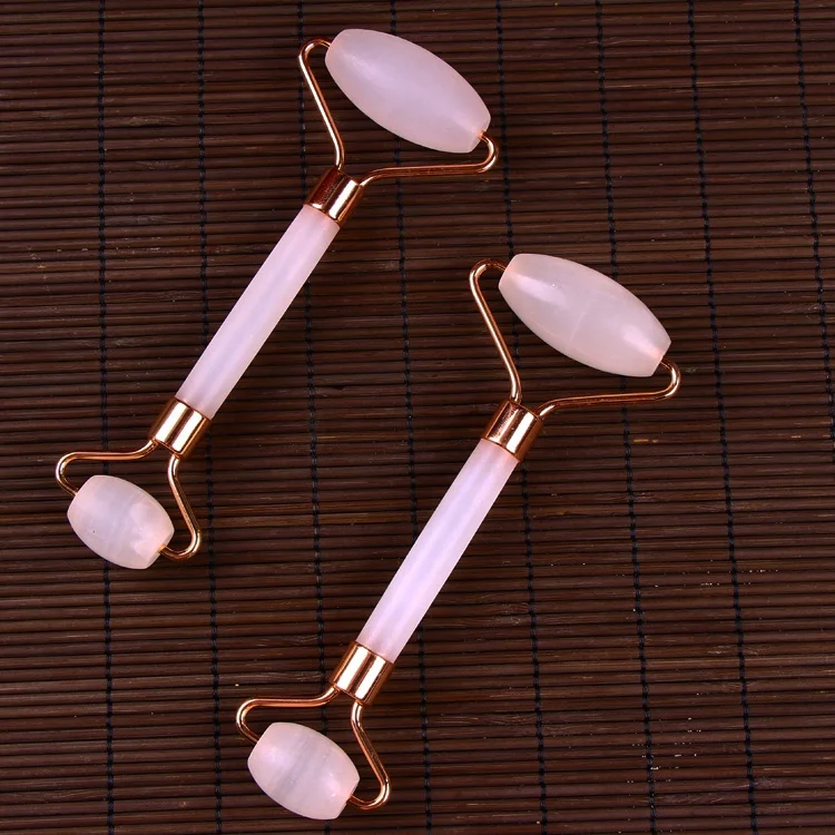 The rose quartz massage roller is used jade roller for face facial