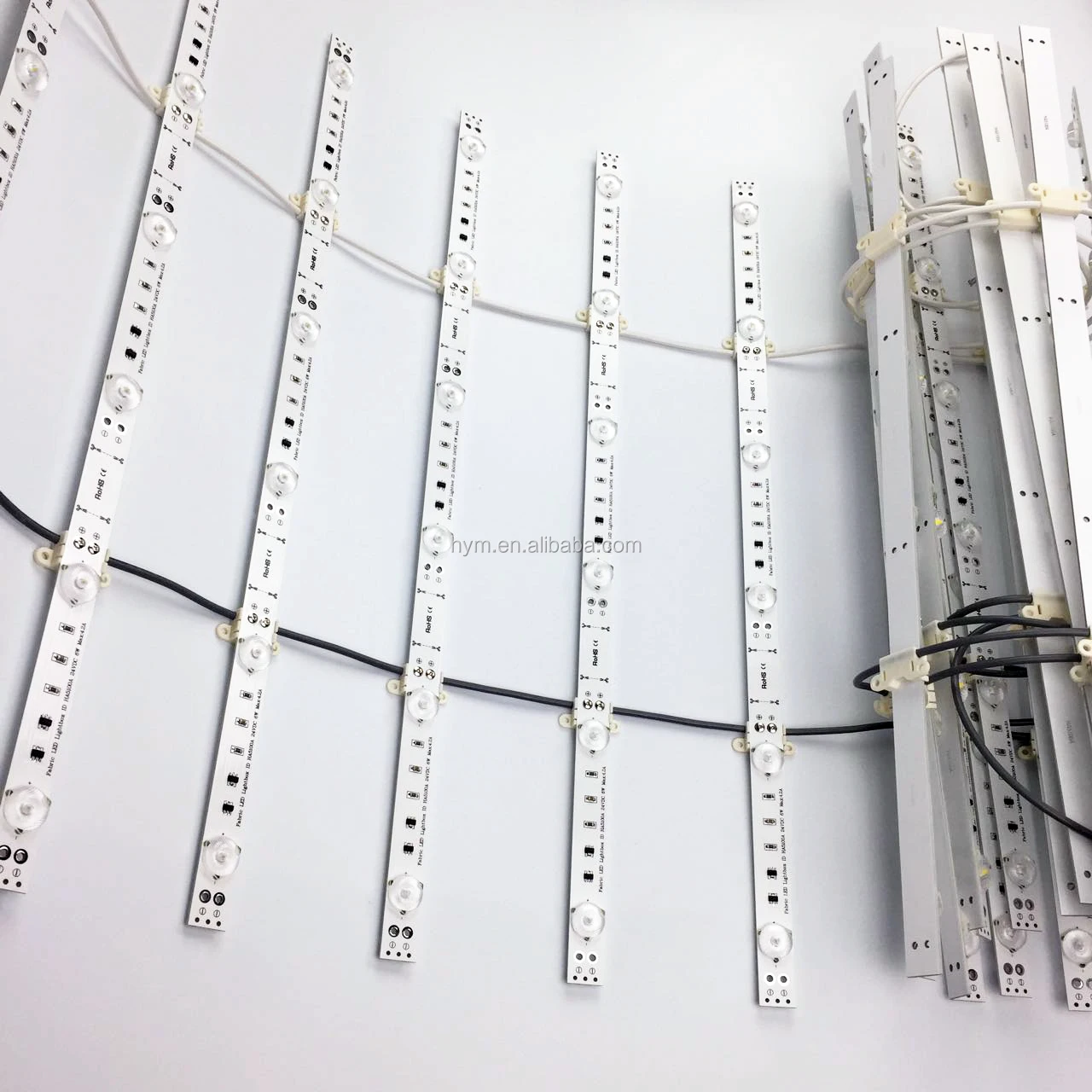 
white color LED lights behind textile graphic panel 