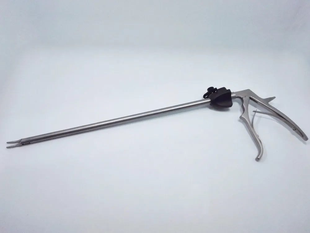 Surgical metal clip applicator for open and laparoscopic surgery