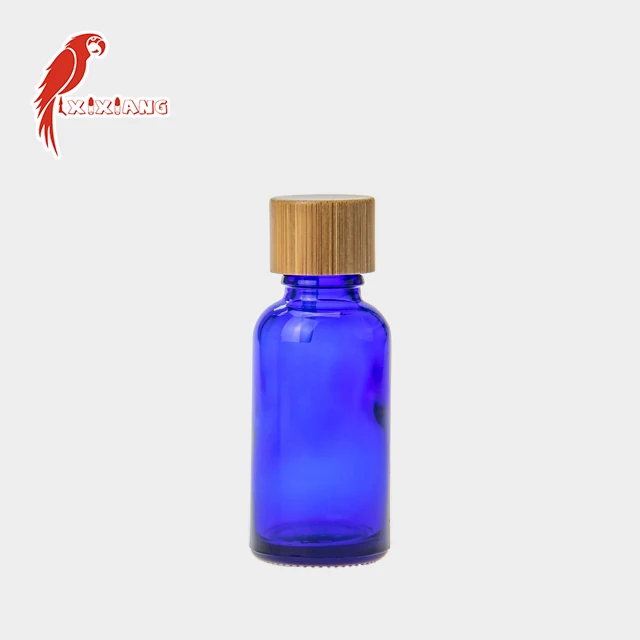 
30ml CBD Blue Glass Bottle with wooden color Childproof Tamper Cap 