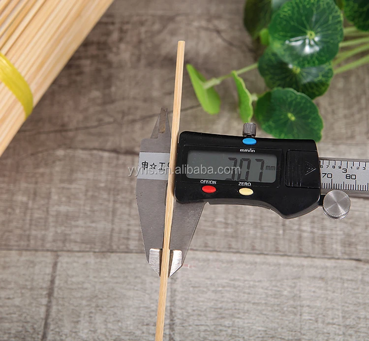 Pick up bamboo wooden sticks for meat