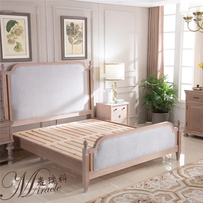 Antique linen upholstered french weathered oak frame bed