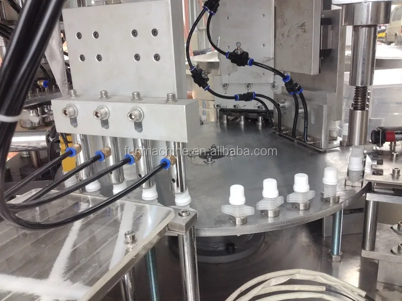 Doy pack Spout pouch cap foil sealing capping assembly machine