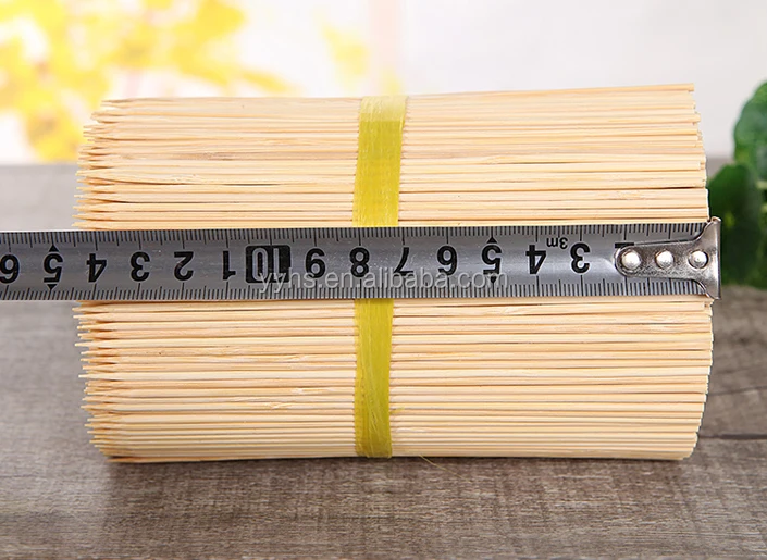 Pick up bamboo wooden sticks for meat