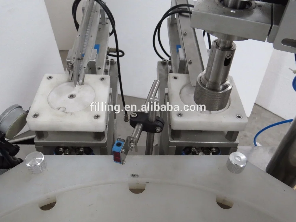 Mechanical hand style double-head filling and capping machine DTNX-60Y type