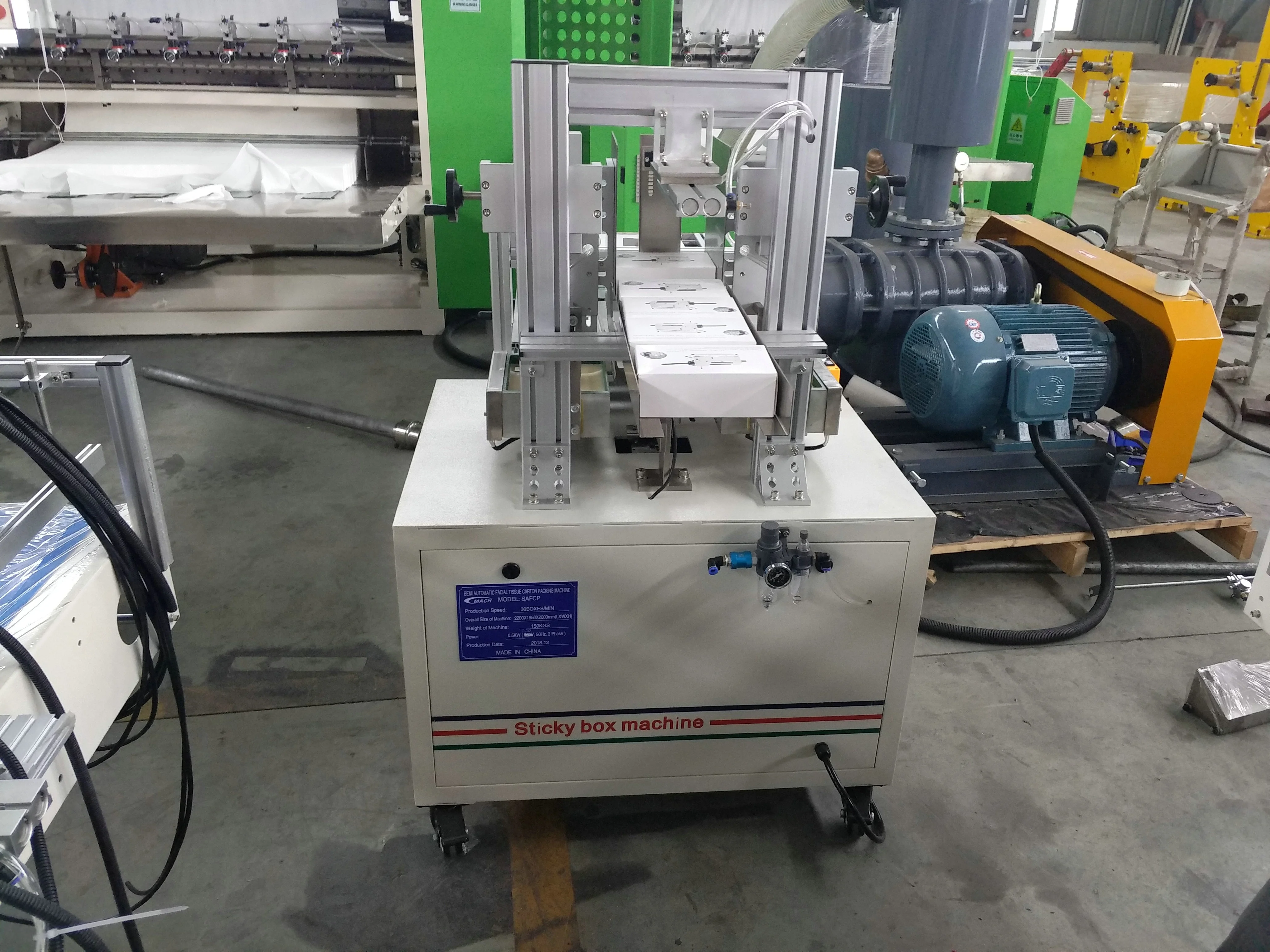 New design mechanical facial tissue box sealing and packing machine