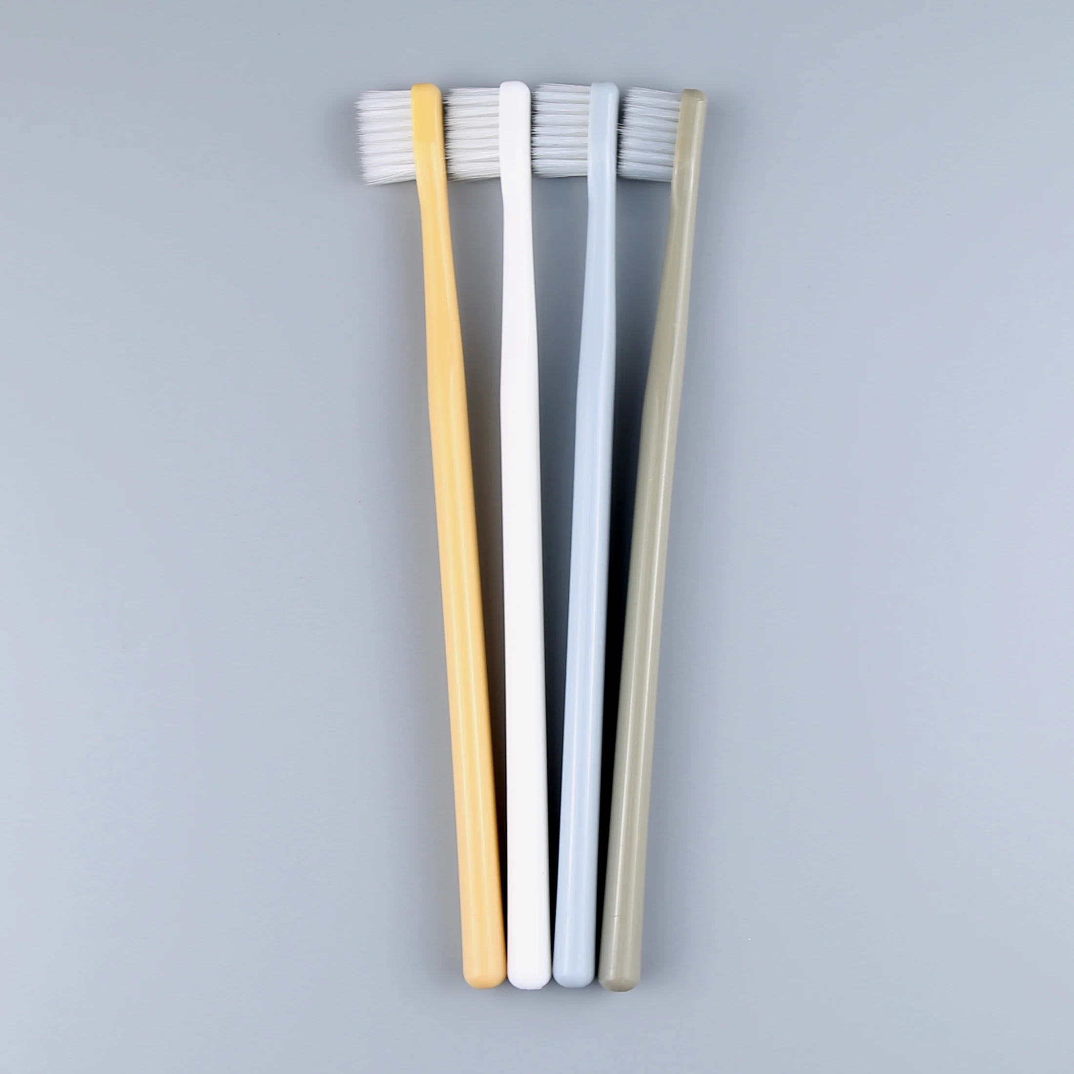 popular design small head toothbrush with super soft bristles in PVC transparent box package.