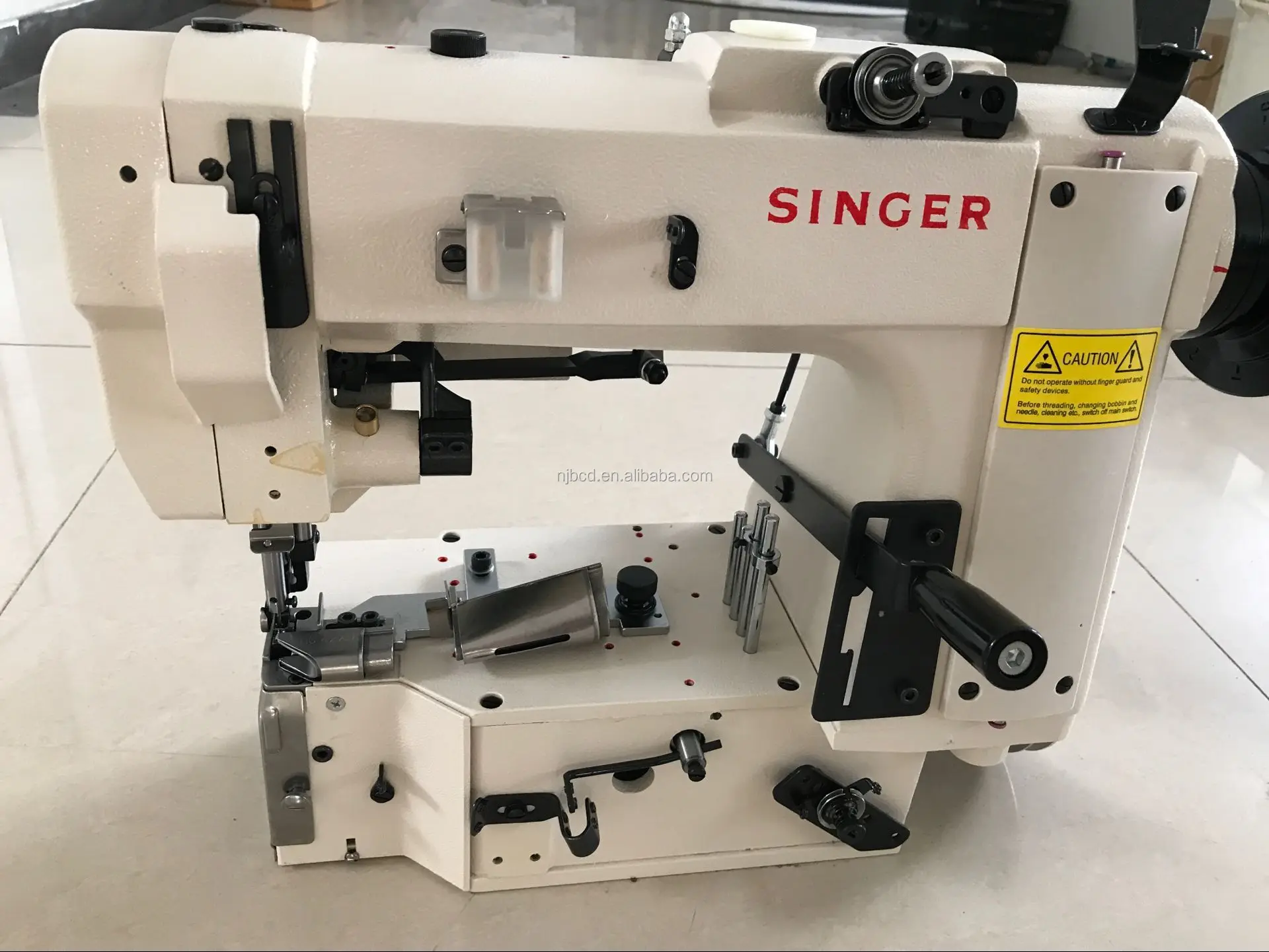 Mattress tape laying machine for mattress machine