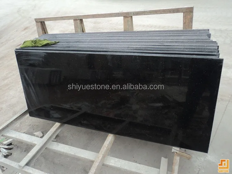 Imported Indian black granite stone cut to stadard tile size