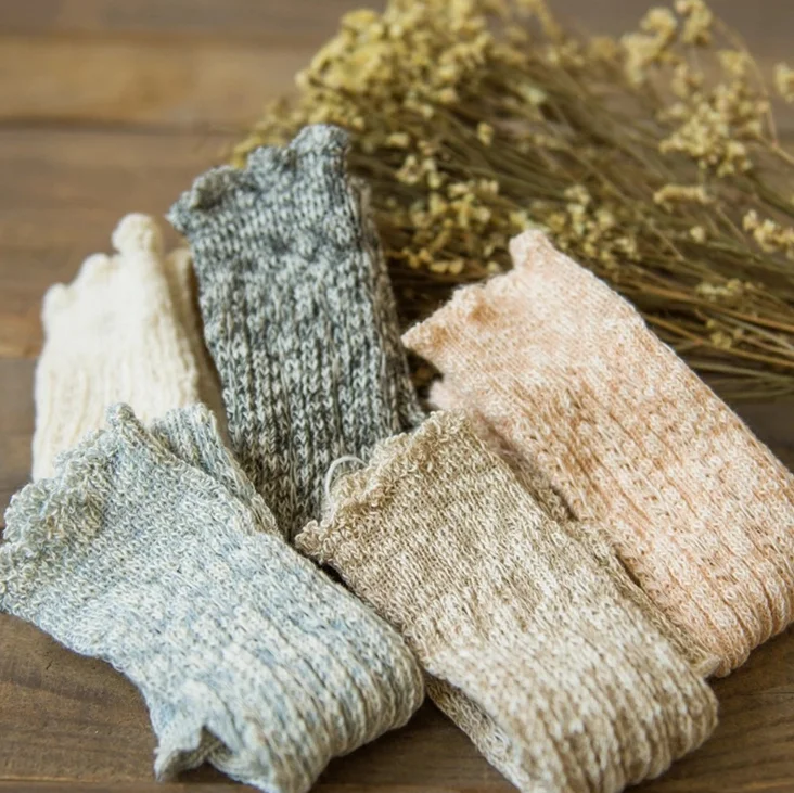 School girl knitting mid-calf lace leg warmer socks