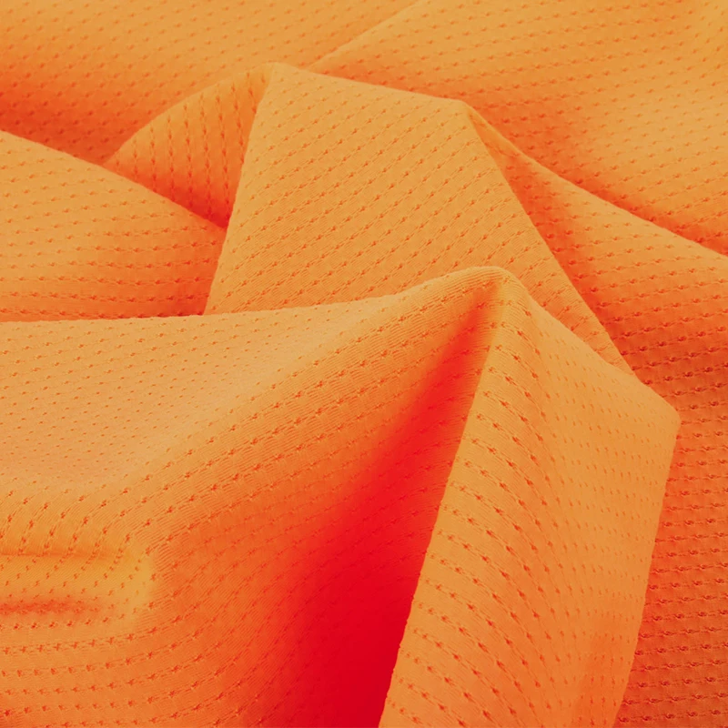 Wholesale 80 nylon 20 spandex orange soft 4 way stretch close hole lace mesh fabric for garment sportswear