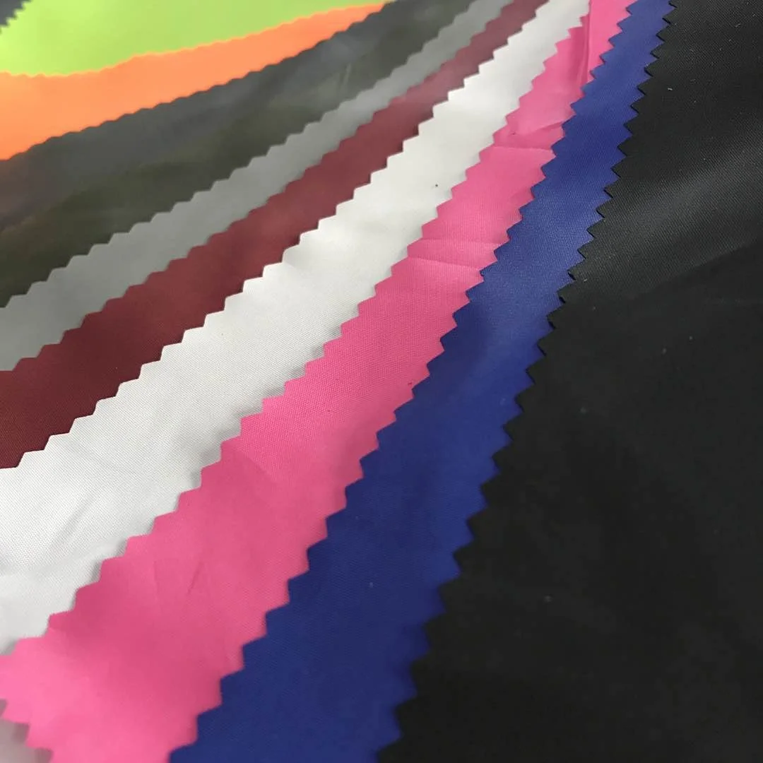 230T 300T Polyester Taffeta NS OIL Cire Fabric For Garment