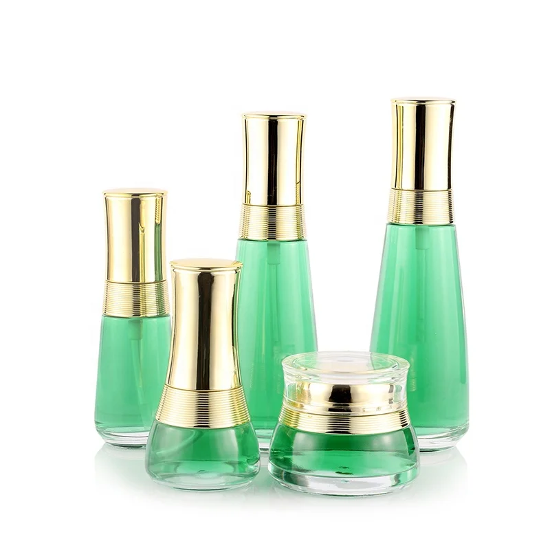 Custom cosmetic packaging transparent skin care glass bottle set with gold cap