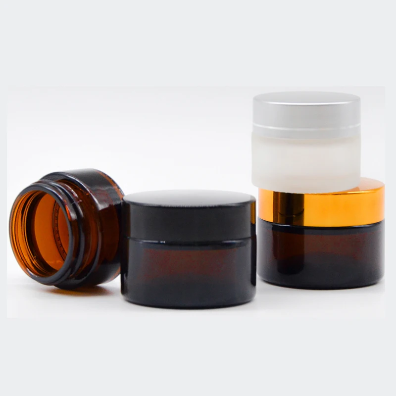 
Empty 30g 50g 100g amber glass cream jar with black plastic lid 