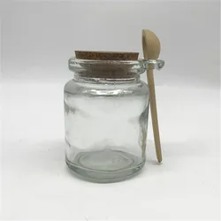 glass jar with wooden spoon   glass essential oil bottle