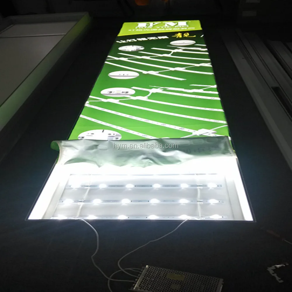 
white color LED lights behind textile graphic panel 
