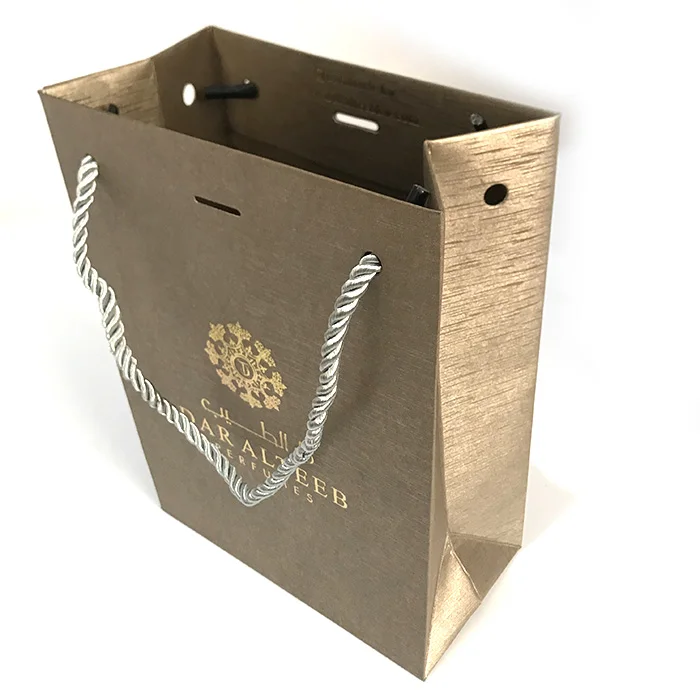 Custom logo printed cheap christmas fancy cosmetic paper shopping jewelry packaging gift bag with rope Twisted handle wholesale