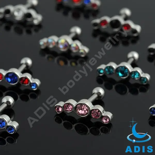 Jeweled ear tragus piercing with helix piercing