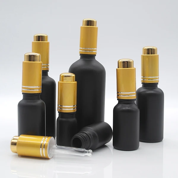 Empty cosmetic oil container 1 oz frosted black glass essential oil dropper bottle with gold pump
