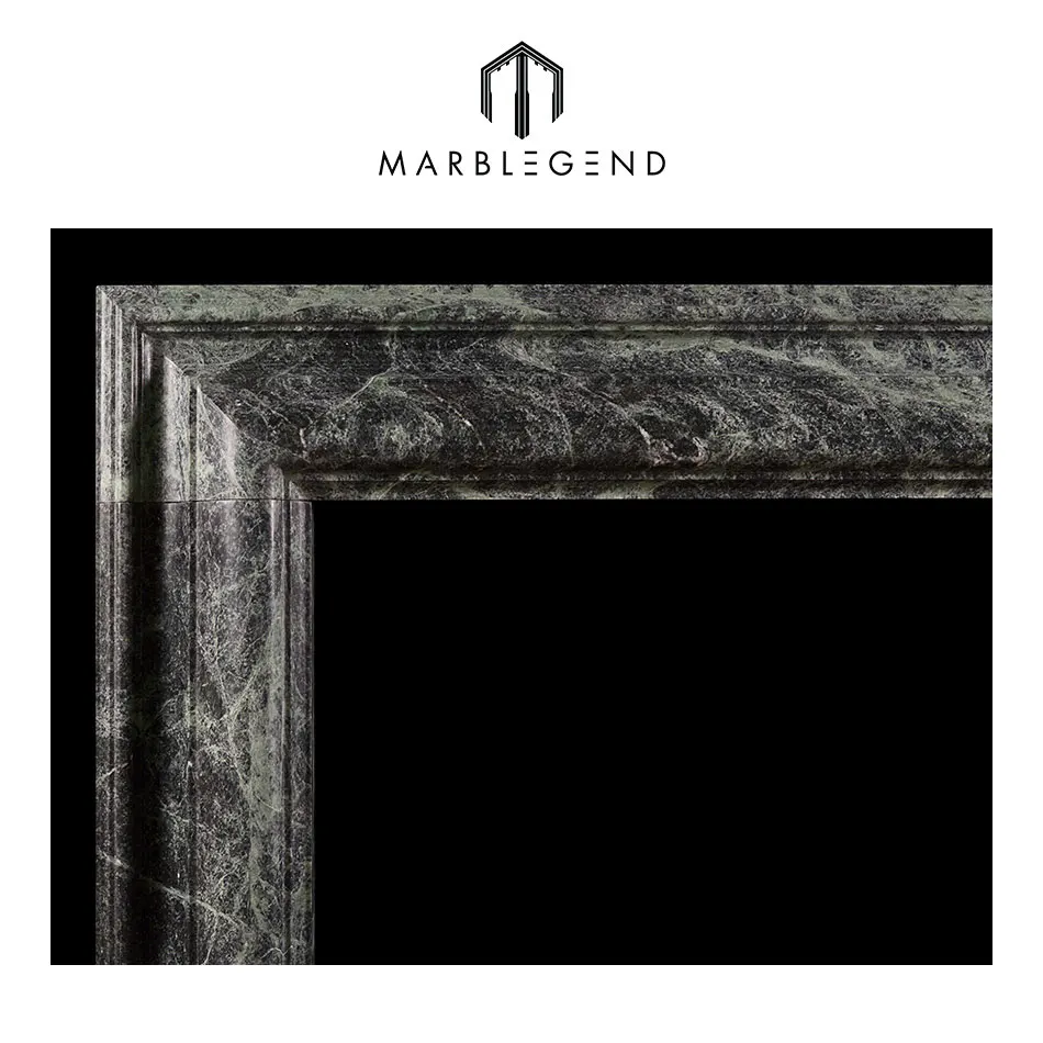 
a queen anne style bolection dark green marble fireplace 