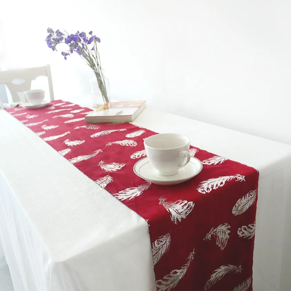 
Suede table runner,bronzed feather design 