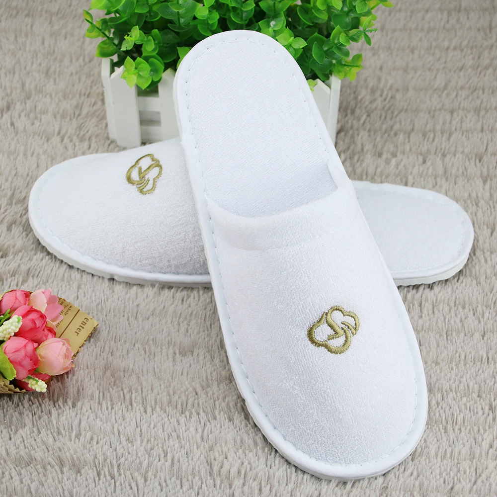 
white terry disposable hotel bathroom slippers 