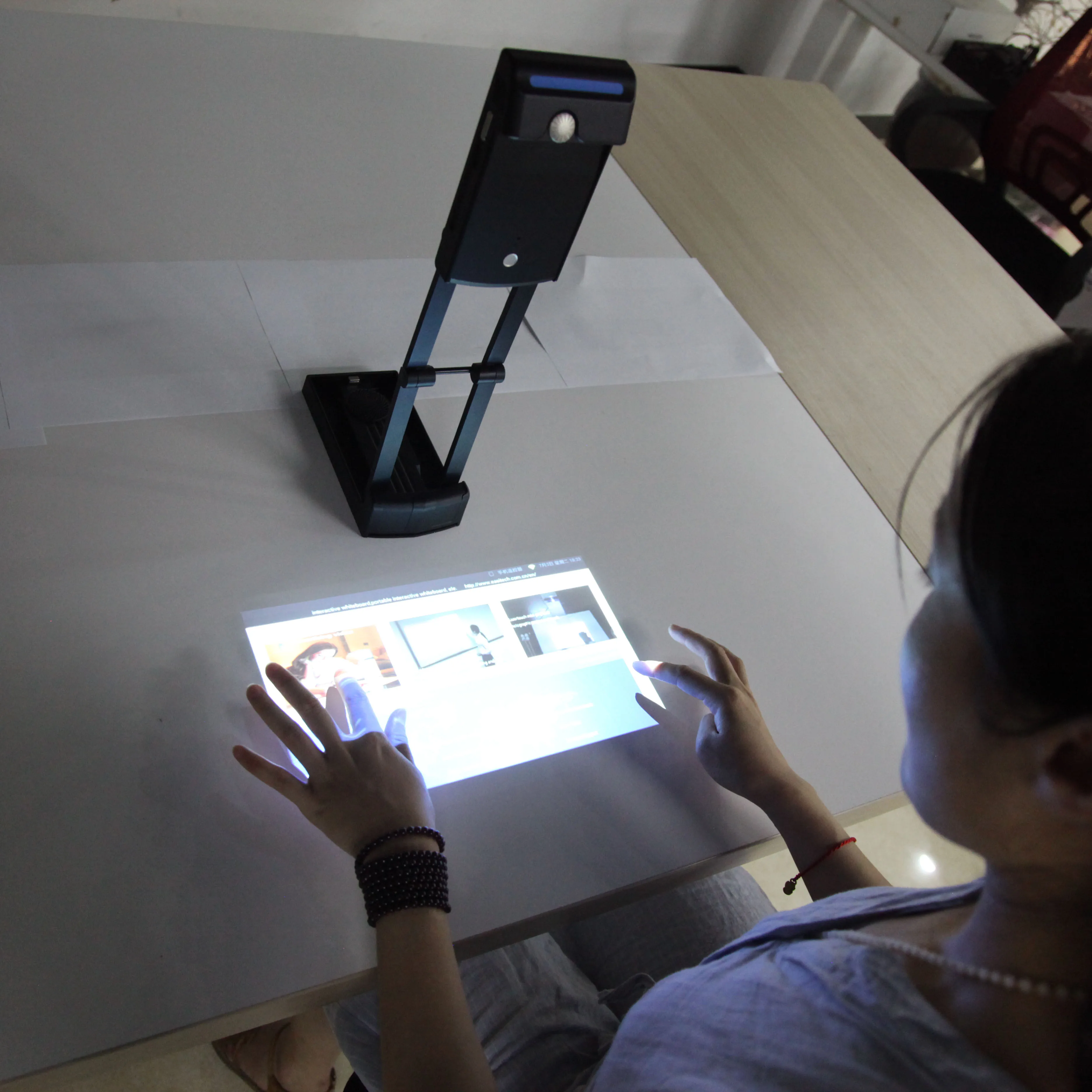 Portable interactive wifi multimedia projector,  laser image calibration technology