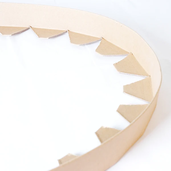 Coil edge protector for irregular round edge