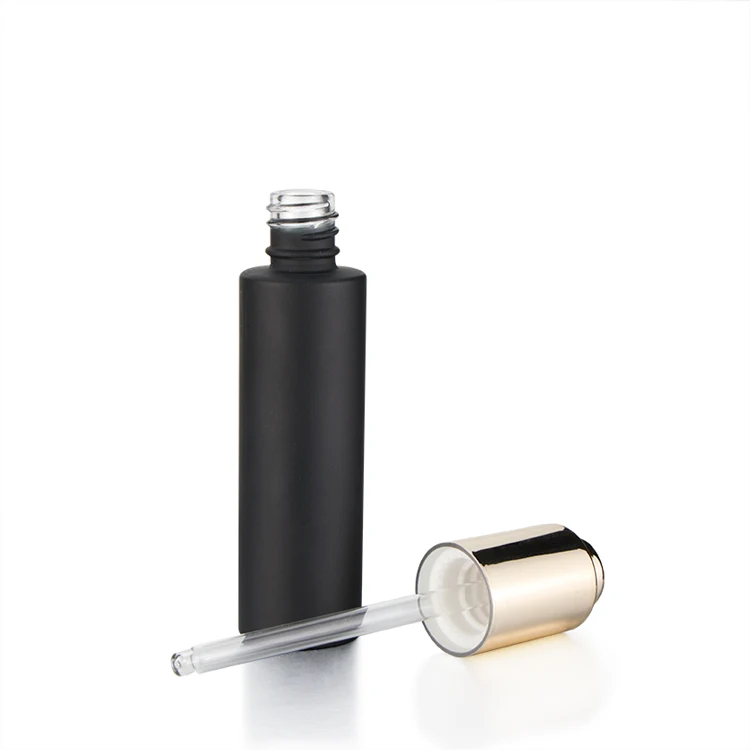 
Fancy label 30ml push button pump black thick cylinder glass cosmetic dropper packaging bottle with dropper or press pump 