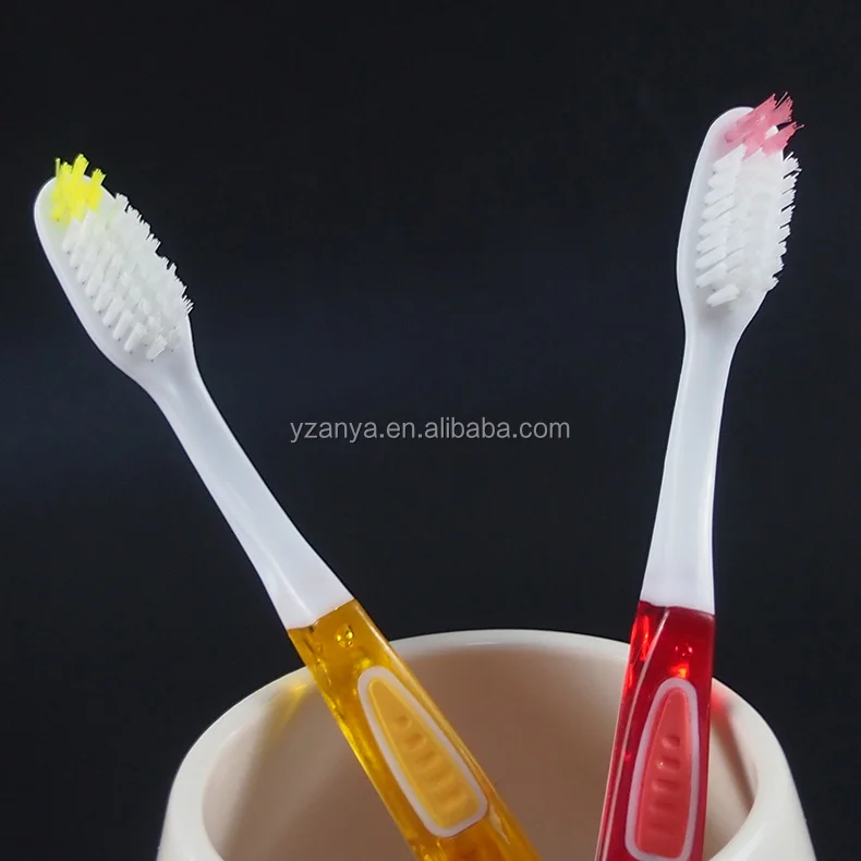 soft rubber handle adult toothbrush with tongue cleaner