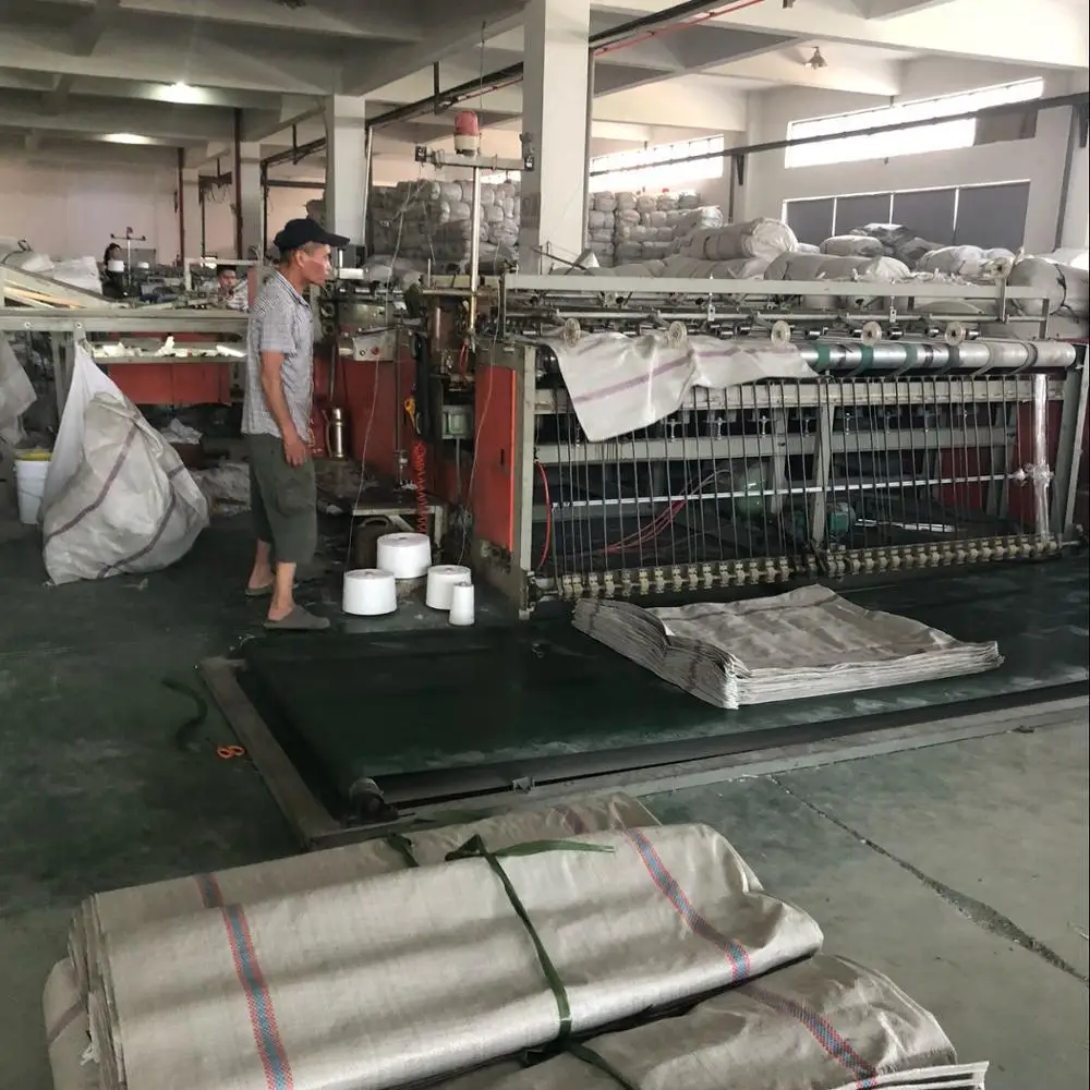 large green plastic woven sack for garbage, construction debris