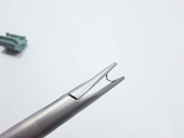 Surgical metal clip applicator for open and laparoscopic surgery