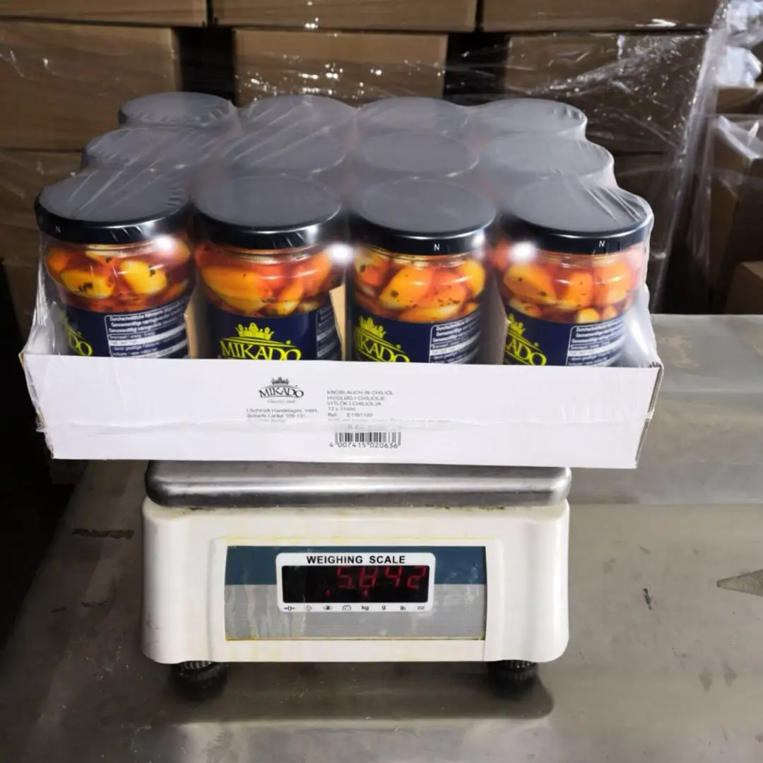 Chinese canned garlic clove with herbs in sunflower seed oil for sal