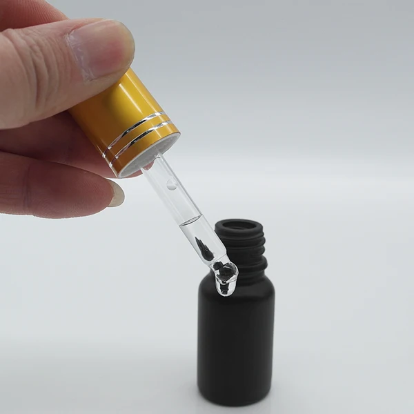 Empty cosmetic oil container 1 oz frosted black glass essential oil dropper bottle with gold pump