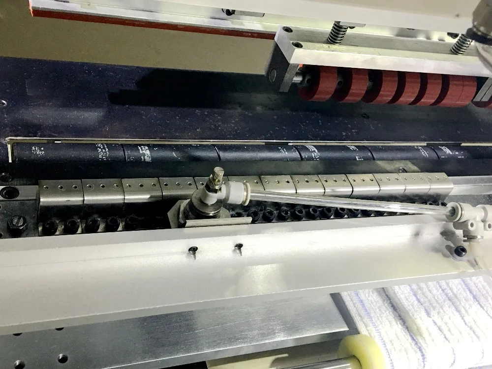 AUTOMATIC TERRY TOWEL CROSS HEMMING MACHINE