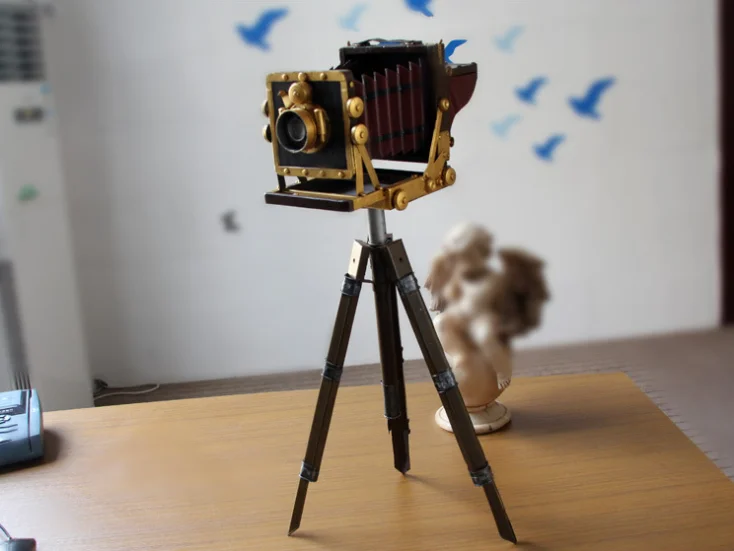 Vintage iron tripod camera model