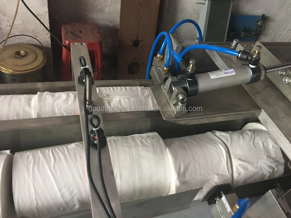 Accumulator log saw cutter toilet paper embossing rewinding kitchen towel producing machine