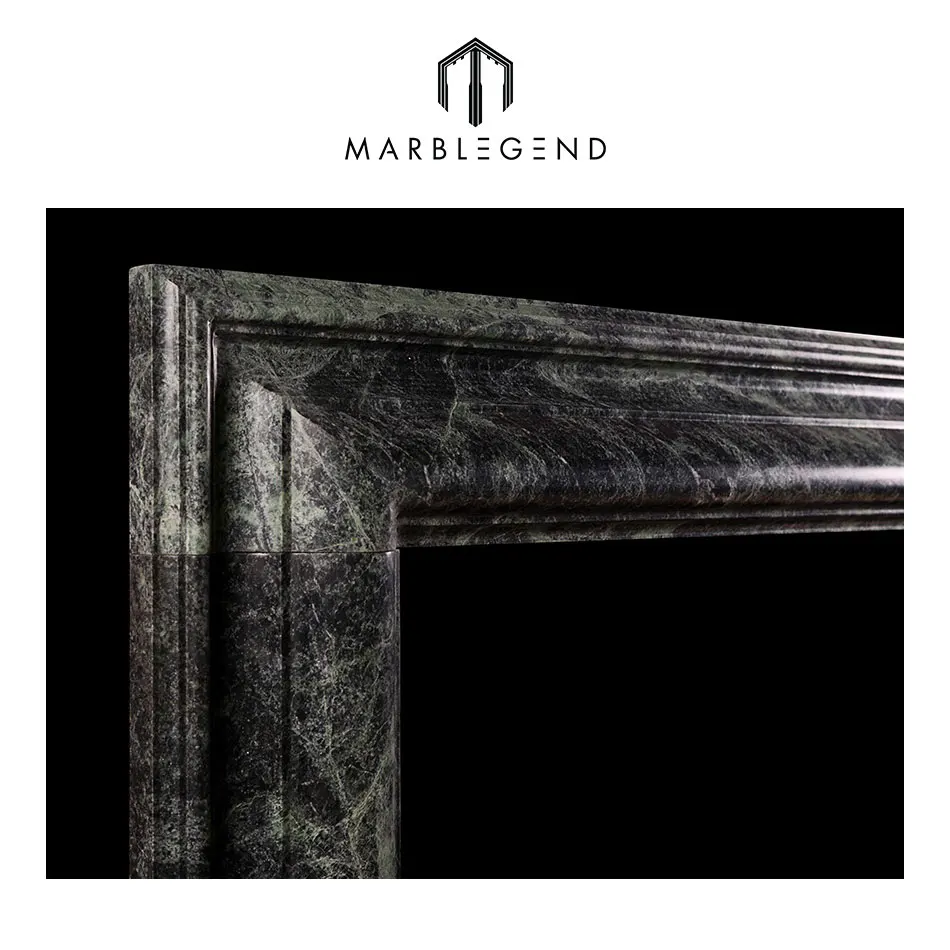 
a queen anne style bolection dark green marble fireplace 